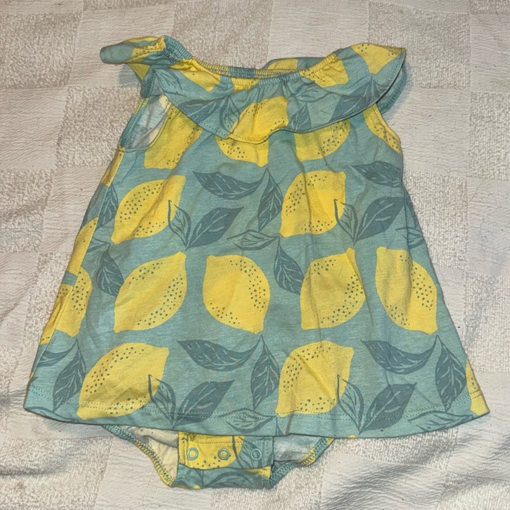 Beautiful lemon shirt with snaps at the bottom, sort of a romper